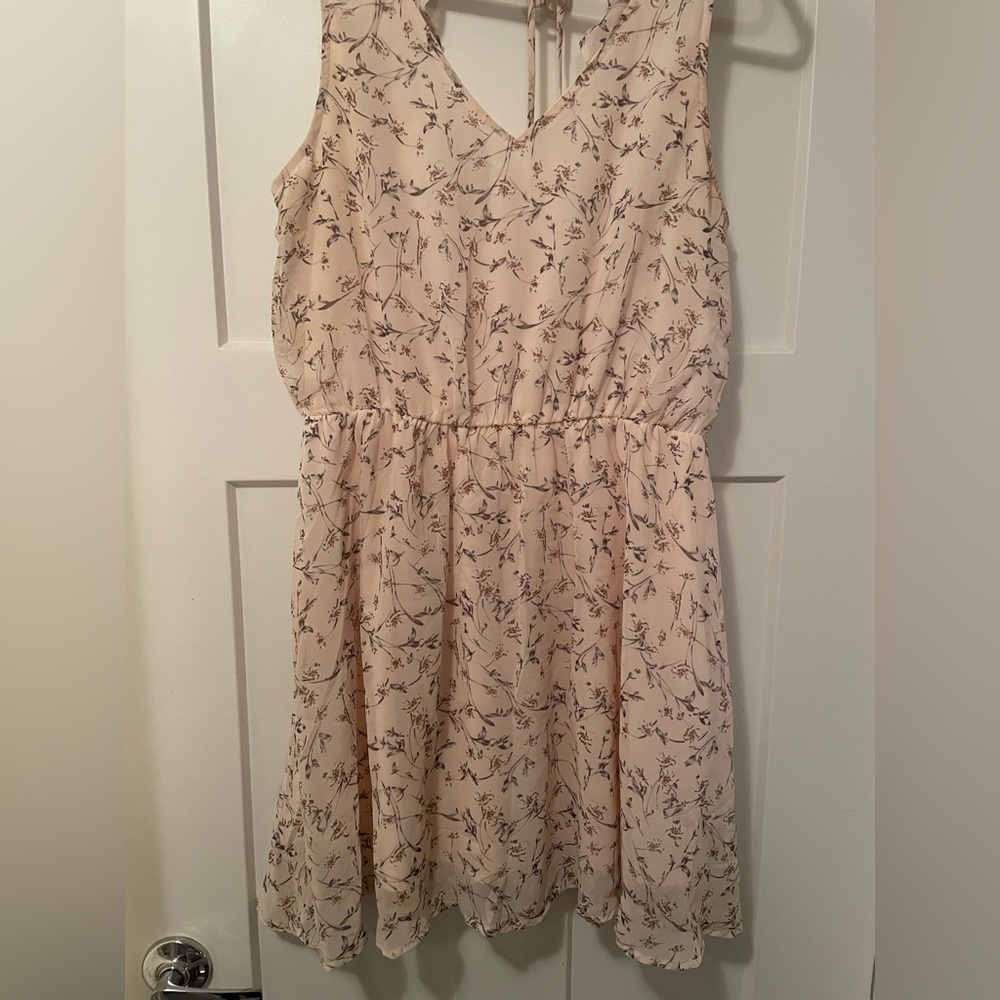 Entro brand mini dress with cute ruffle back detail